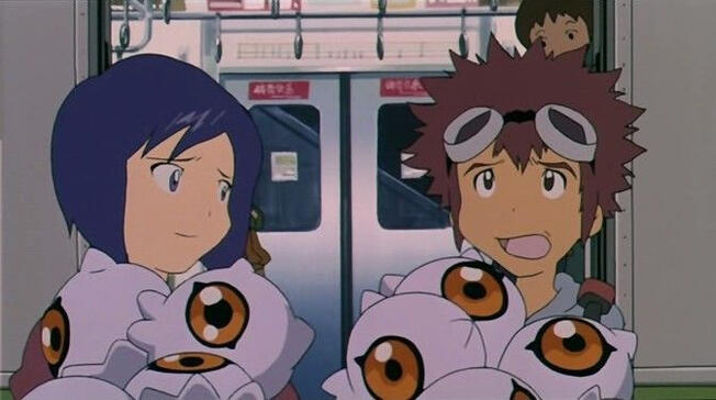 Two characters in a subway train. The one on the left is ken and the right is davis both are holding many jellyfish like digimon