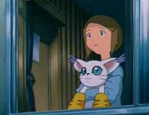 image of kari and gatomon looking out a window